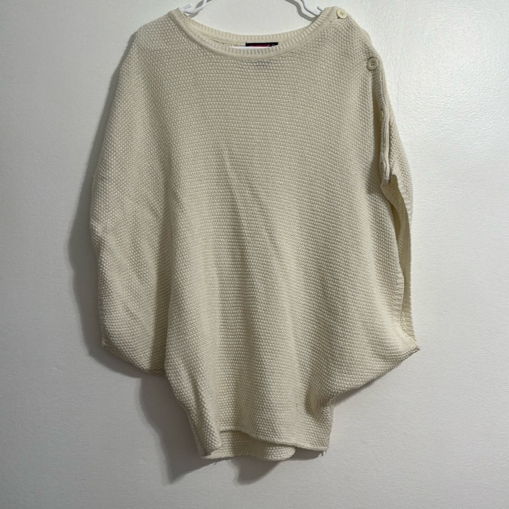 Used short sleeve poncho sweater with buttons on one arm
